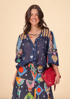 Blue printed chiffon shirt with V-neck and voluminous balloon sleeves