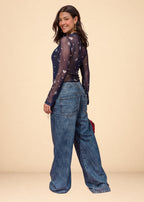 Rigid indigo denim jean with belted waistband, straight leg, and functional pockets, view 4