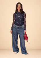 Rigid indigo denim jean with belted waistband, straight leg, and functional pockets, view 2