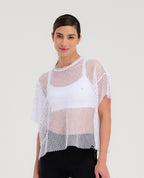 Camiseta cropped blanca St Even en malla transpirable, cuello redondo y silueta holgada para mujer.