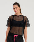 Camiseta deportiva St Even para mujer en malla negra transpirable, estilo cropped holgado de manga corta.