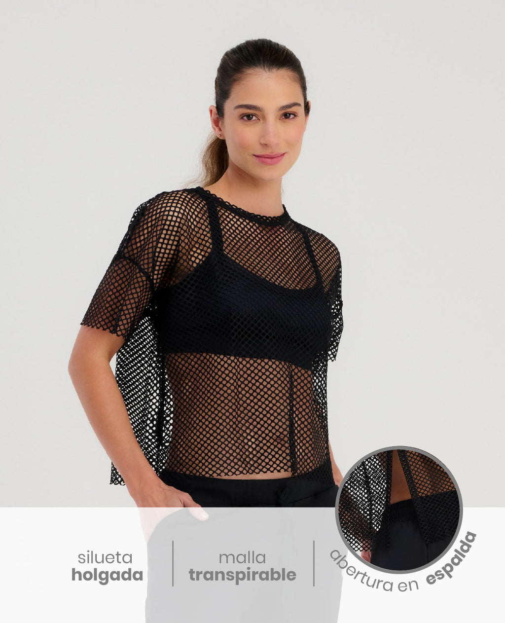 Camiseta deportiva cropped St Even para mujer en malla negra transpirable de silueta holgada con abertura en espalda.