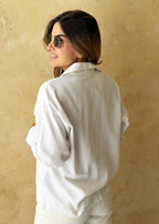 ivory linen shirt cuffed sleeve close-up
