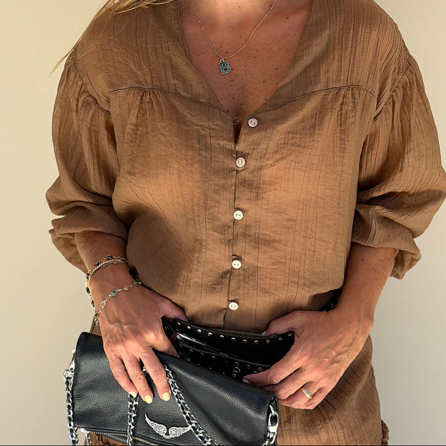 brown long sleeve shirt V-neck close-up