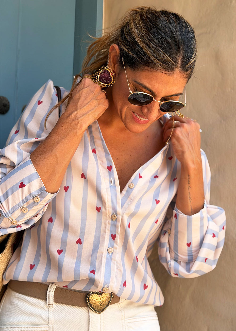 Blue challis shirt with all-over red heart print, sport collar, and gathered sleeves
