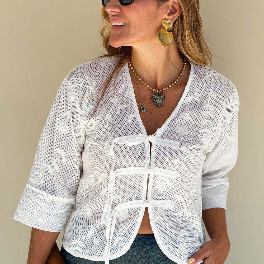 ivory embroidered woven shirt V-neckline knotted button placket front view