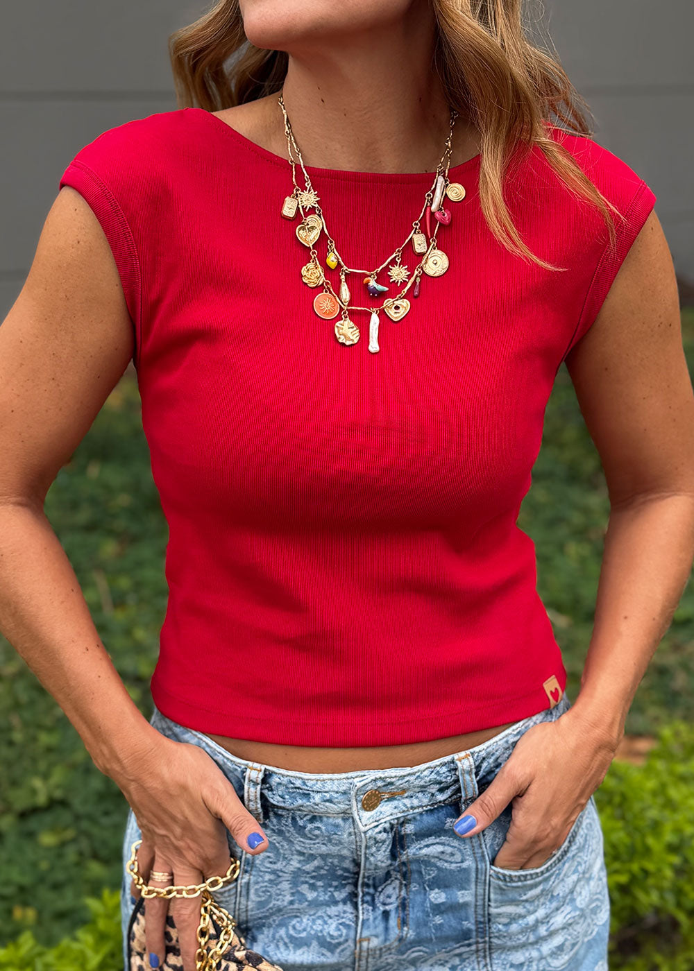 Red ribbed cotton sleeveless top with semi-boatneck front and deep back neckline
