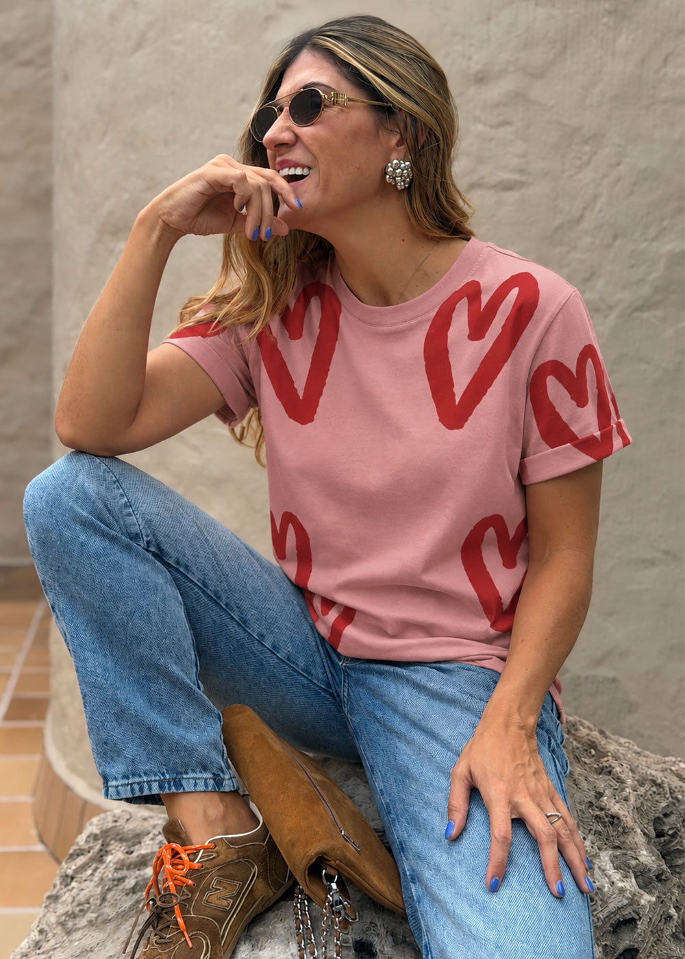 Coral cotton knit tee with all-over contrast heart print and drop-shoulder sleeves