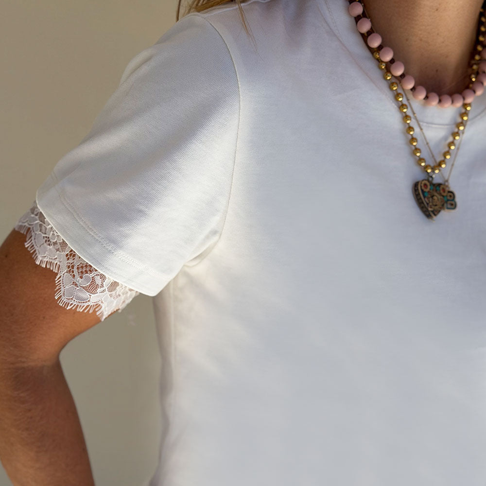 ivory lace-trim t-shirt round neckline semi-fitted silhouette