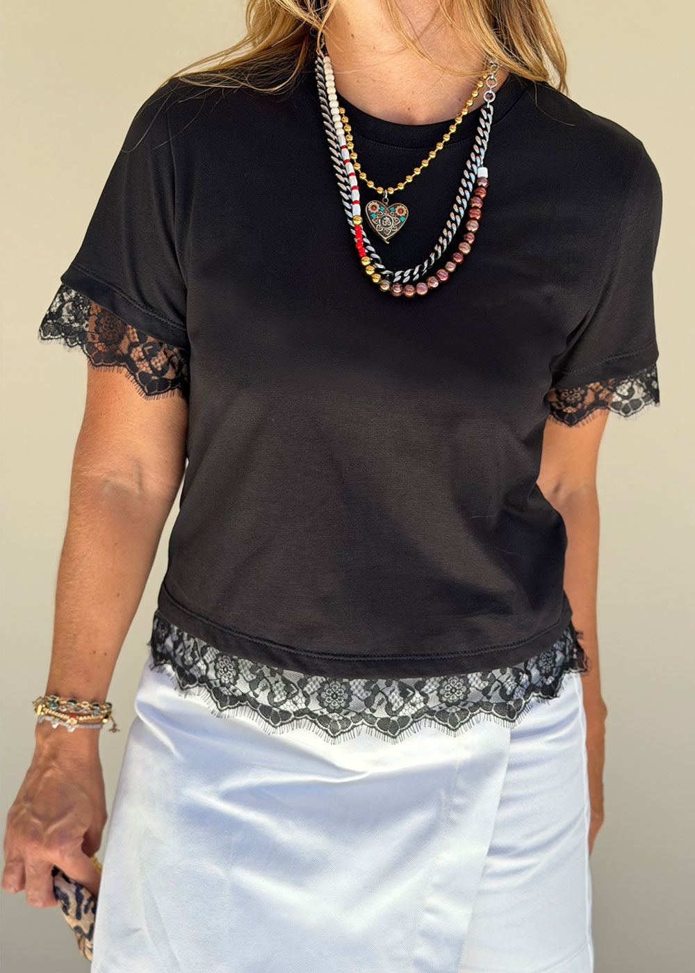 black cotton t-shirt delicate black lace sleeve trim detail close-up