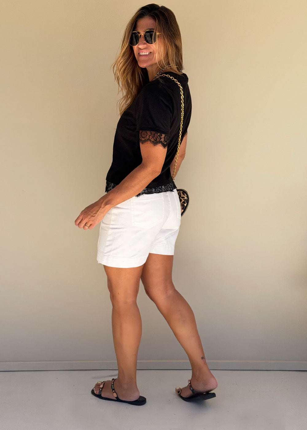 black cropped cotton tee side profile lace details