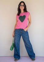 Pink acrylic knit vest with round neck and contrast green heart motif at the chest, view 4