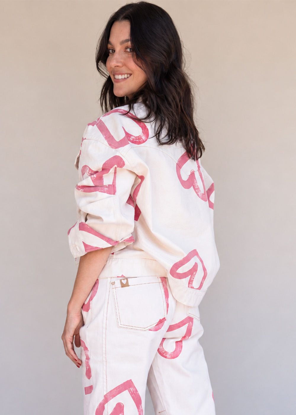 Ivory cotton drill denim jacket with all-over red heart print, front pockets, and barrel sleeves, view 4