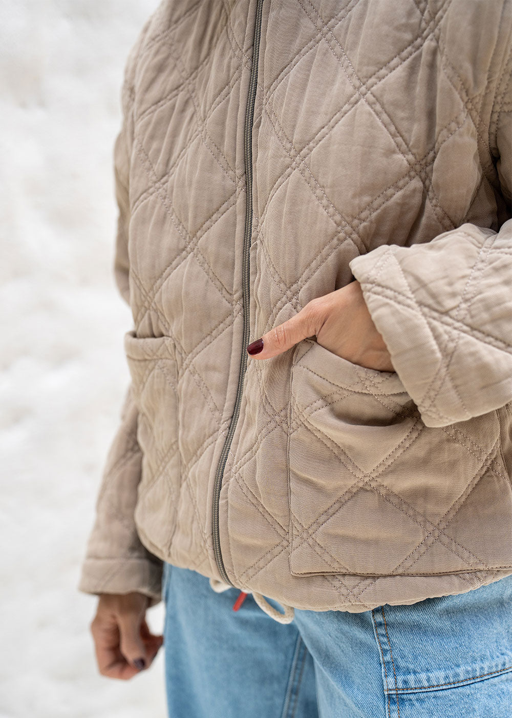 green jacket drawstring hem adjustment detail