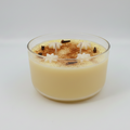 Glass candle with decorative elements on a white background
