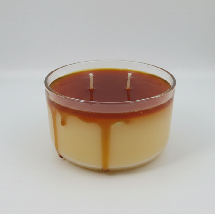 Glass candle with a design resembling a coffee cup on a white background