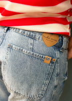 Washed indigo denim jean with belt loops, functional pockets, side cuts, and knee darts, view 6