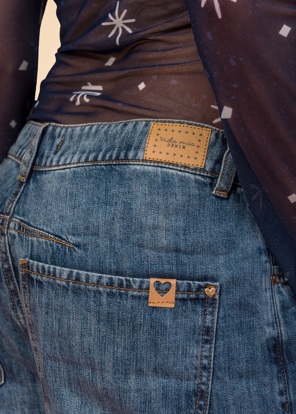 Rigid indigo denim jean with belted waistband, straight leg, and functional pockets, view 3