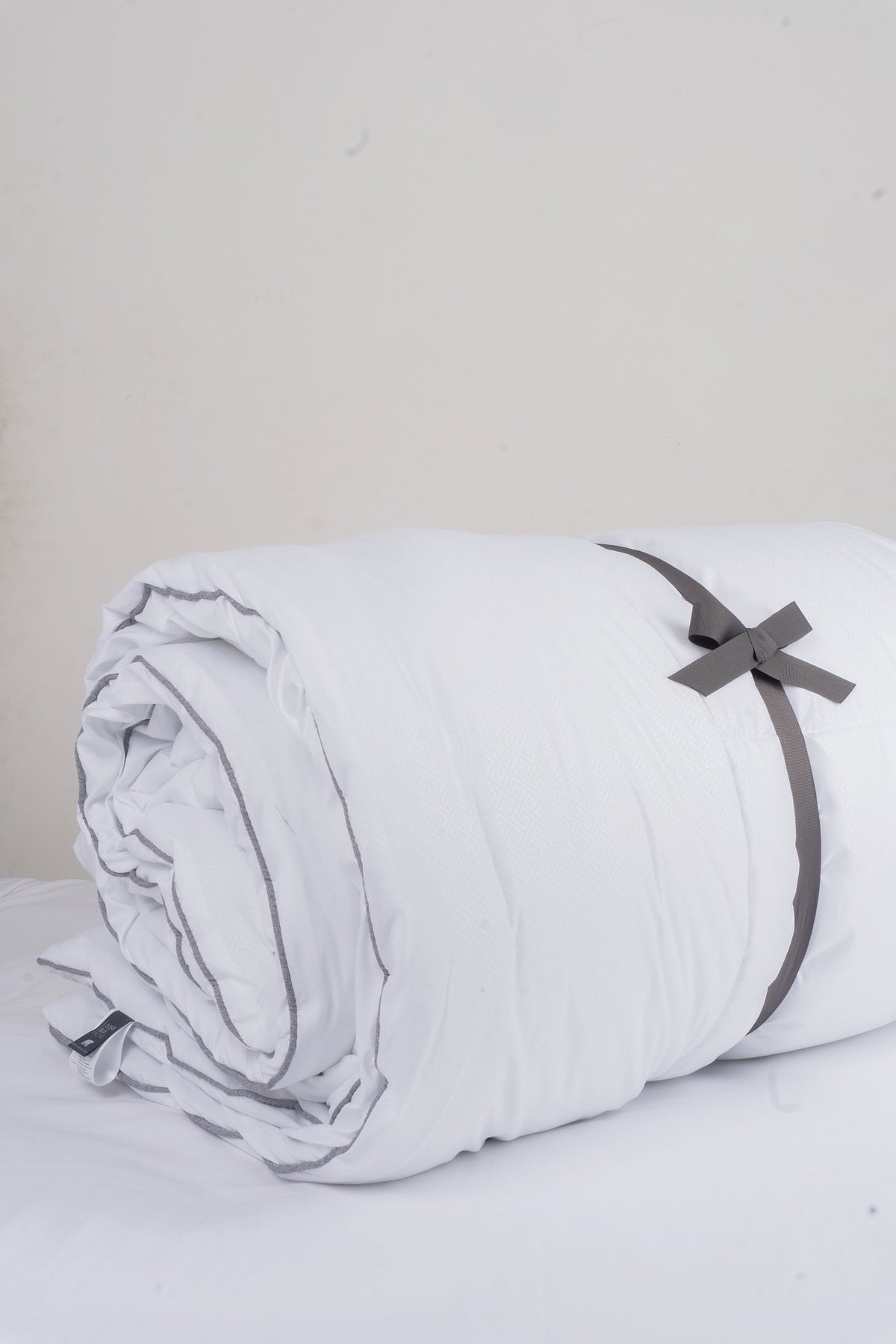 Cozy Montecarlo duvet insert with a lightweight, warm design and grid stitching to keep the eco-feather filling in place.