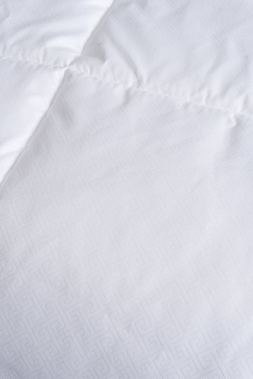 Cozy Montecarlo duvet insert with a soft, lightweight design and quilted vertical and horizontal stitching for even warmth.