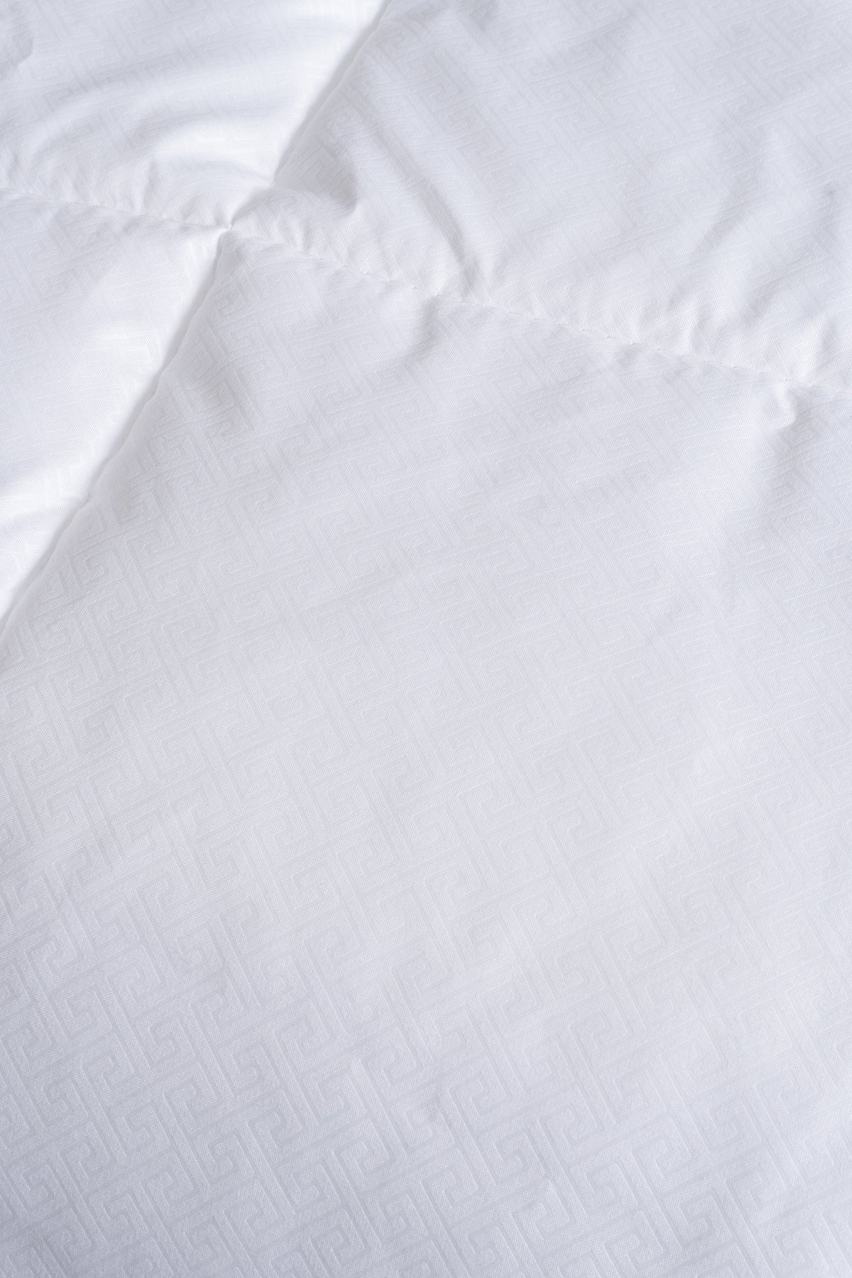 Cozy Montecarlo duvet insert with a soft, lightweight design and quilted vertical and horizontal stitching for even warmth.