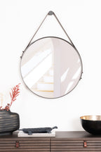 Sleek round Boston Mirror with a sturdy steel frame and elegant leather strap, perfect for adding modern charm to any room.
