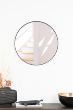Elegant round Rotterdam mirror with a sleek steel frame, adding modern style and brightness to any room.
