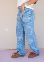 Indigo cotton drill jean with paisley print, barrel leg, and patch back pockets, view 6