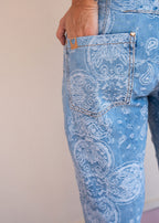 Indigo cotton drill jean with paisley print, barrel leg, and patch back pockets, view 5