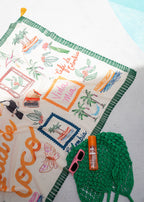 Green printed sarong with linen effect and tassel trim, draped view