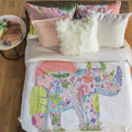 Vibrant duvet set featuring a whimsical rhinoceros print made of flowers on soft cotton-polyester blend fabric.