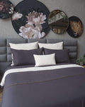 Elegant Bruna Gris duvet cover set in a soft gray tone, crafted from a cozy cotton-polyester blend for bedroom sophistication.