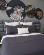 Elegant Bruna Gris duvet cover set in a soft gray tone, crafted from a cozy cotton-polyester blend for bedroom sophistication.