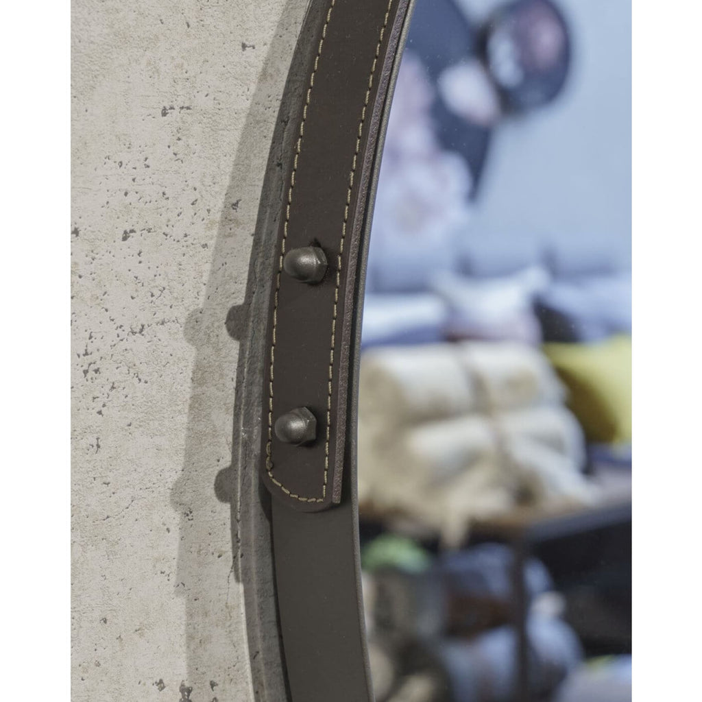 Elegant round Boston mirror with a sturdy steel frame and leather strap, adding a modern, luminous touch to any room.