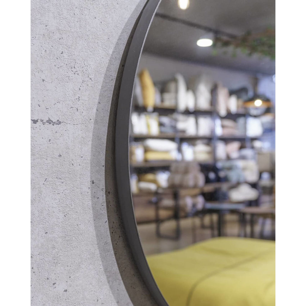 Elegant round Rotterdam mirror with a sleek steel frame, adding modern style and brightness to any room.