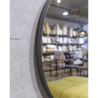 Elegant round Rotterdam mirror with a sleek steel frame, adding modern style and brightness to any room.