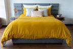Vibrant Kalahari Mostaza duvet cover set in a striking mustard hue, featuring unique patterns and a sleek zipper closure.
