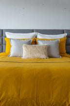 Cozy Kalahari Mostaza duvet cover set in a vibrant mustard hue, featuring unique patterns and a sleek zipper closure.