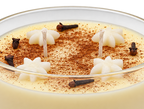 Close-up of the Majarete candle, showing cream-colored flower shapes, brown speckles and wicks.