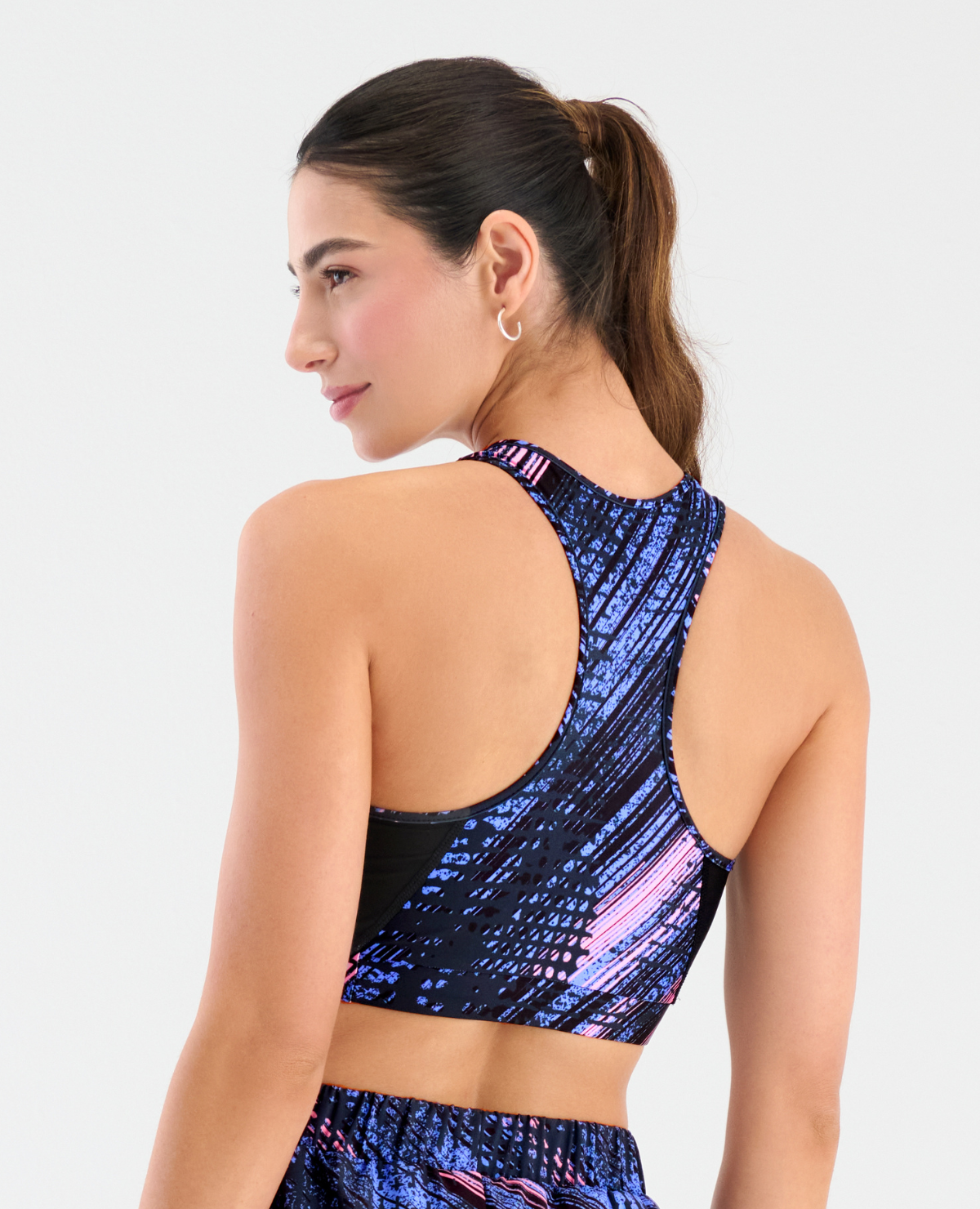 Top deportivo para mujer St. Even con espalda cruzada y estampado azul con rosa, ideal para yoga y entrenamiento.